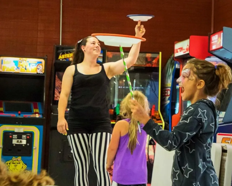 Circus performer teaching kids