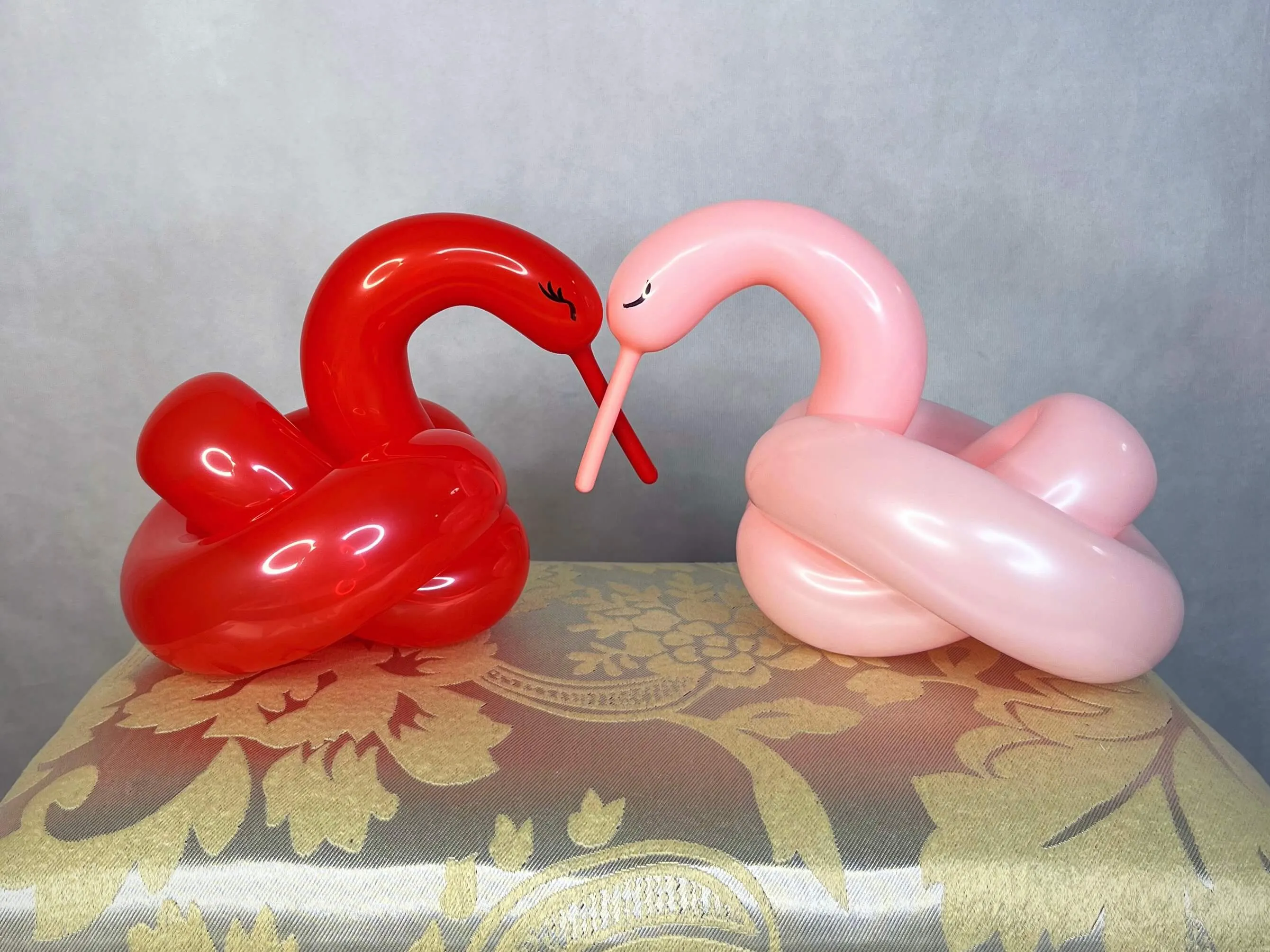 Balloon sculpture of two swans