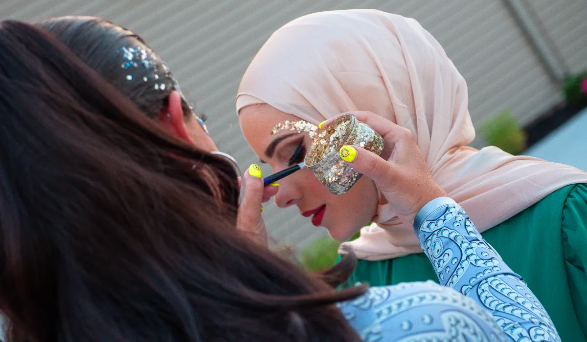 A beautiful face adorned by intricate glitter art