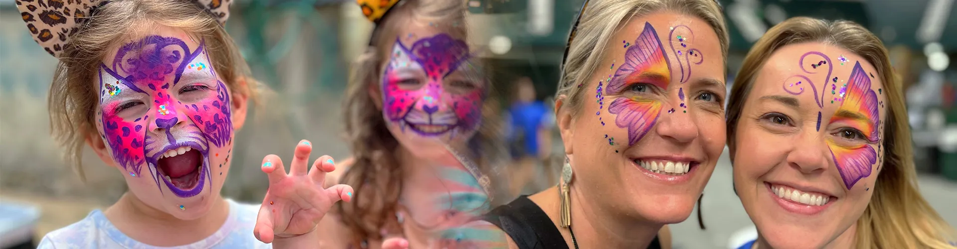 A kid and 2 women with facepainting.