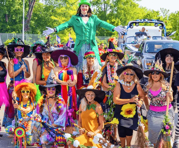 A group of women wearing colorful dresses.