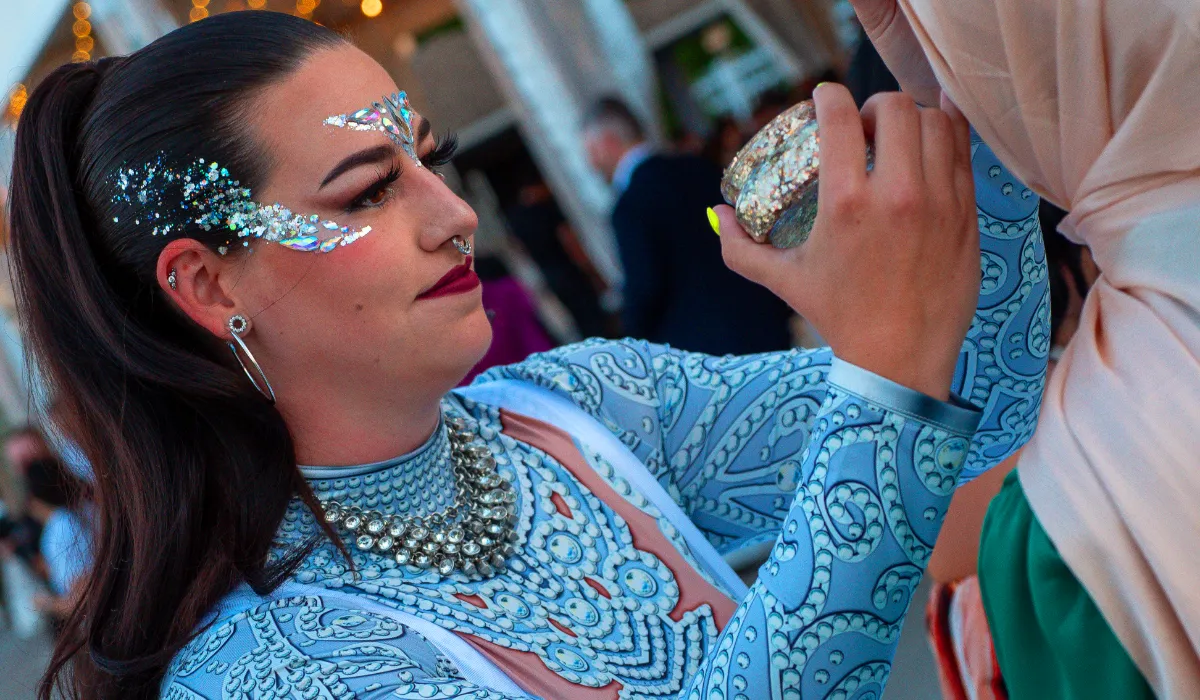 A beautiful face adorned by intricate glitter art